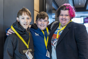 Young friends pose together at Reach 2026