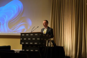 A person delivers a speech on a stage