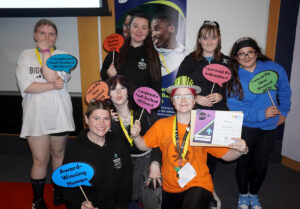 A youth group pose with their newly received Hi5 Award